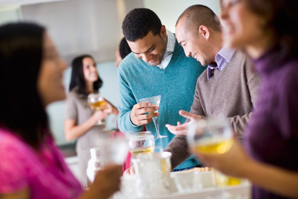 Friends Talking at a Party --- Image by © Tim Pannell/Corbis